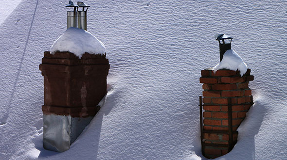 Ice dams formed by a poorly insulated chimney