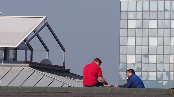 Commercial roof maintenance before applying a protective coating