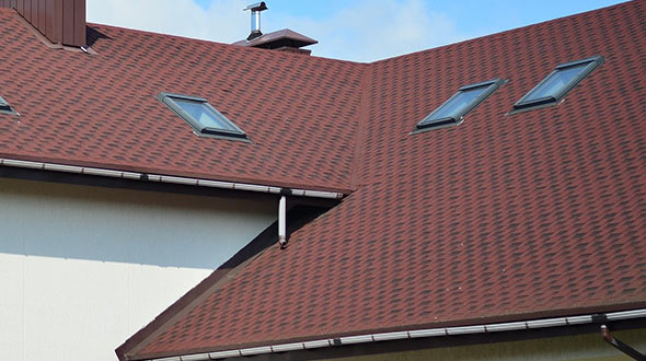 Shingles and tiles on a commercial sloped roof