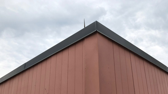 Commercial roofing system metal eaves flashing
