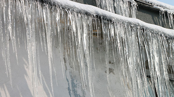 Commercial roofing damage from ice dams