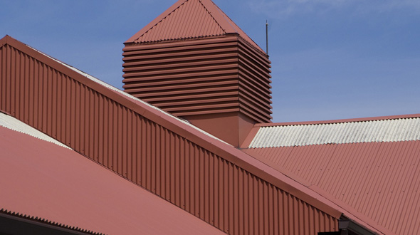 Painted metal roofing system on commercial building