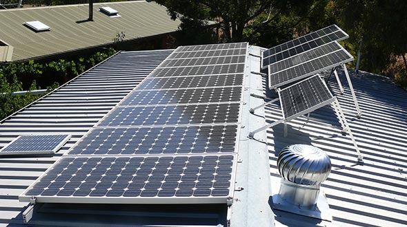 Solar panels installed on a commercial metal roofing system